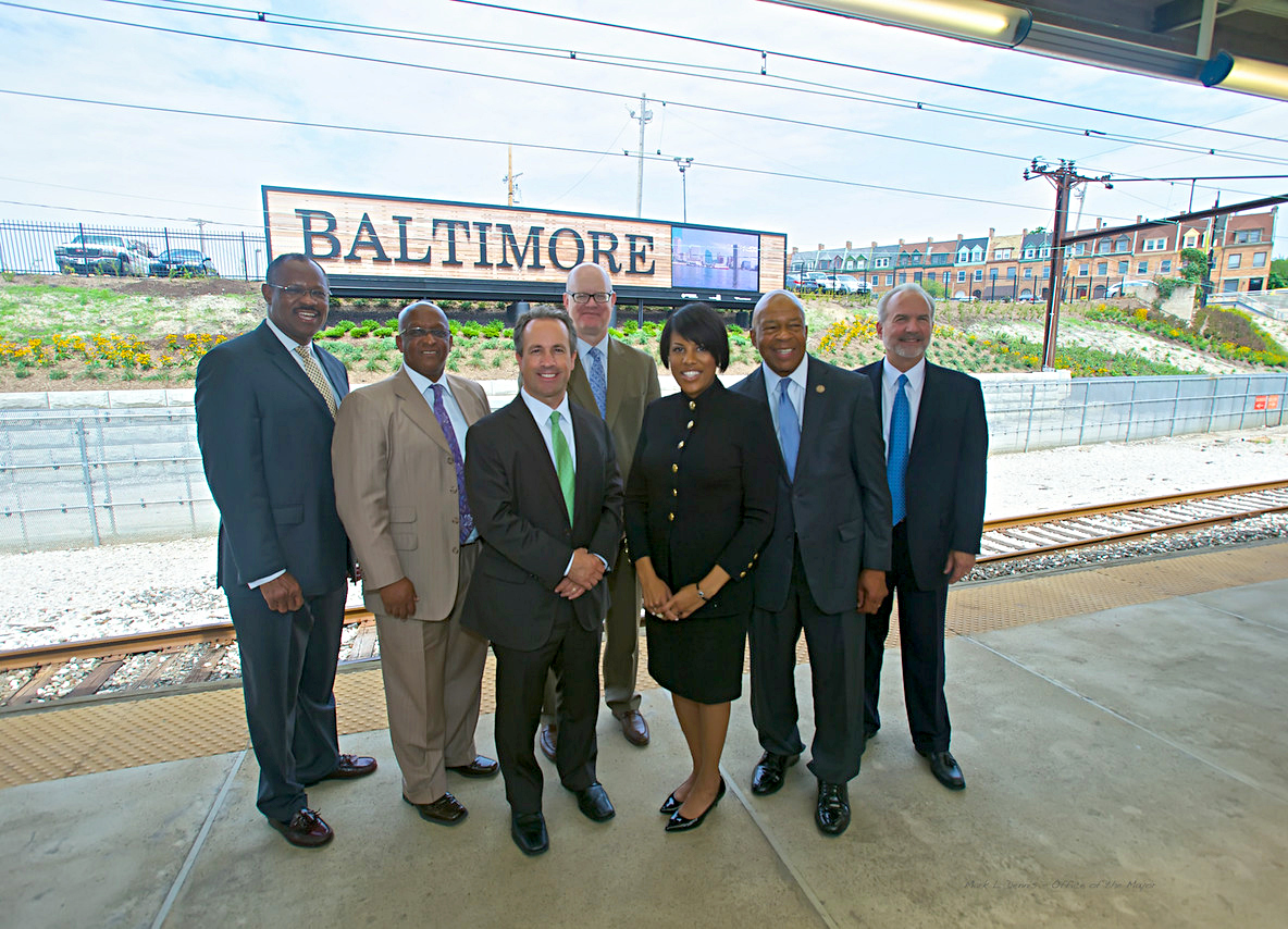 IMAGE: Mayor Rawlings-Blake and a number of City and State officials unveil a new welcome sign at Penn Station